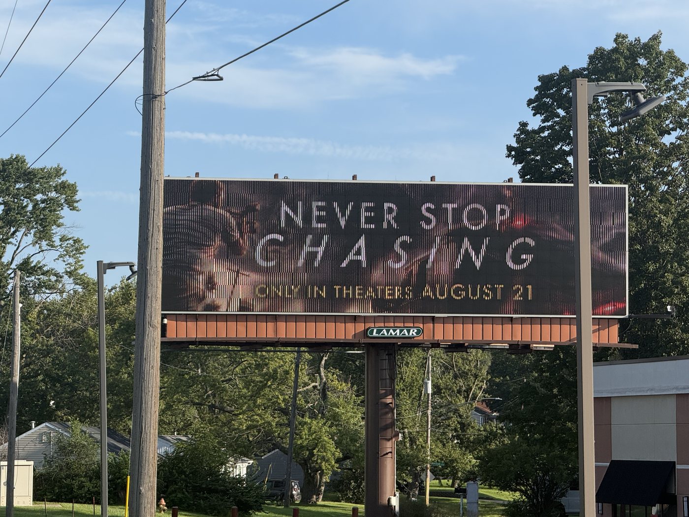 Never Stop Chasing digital bulletin, Panel 80010, campaign photography