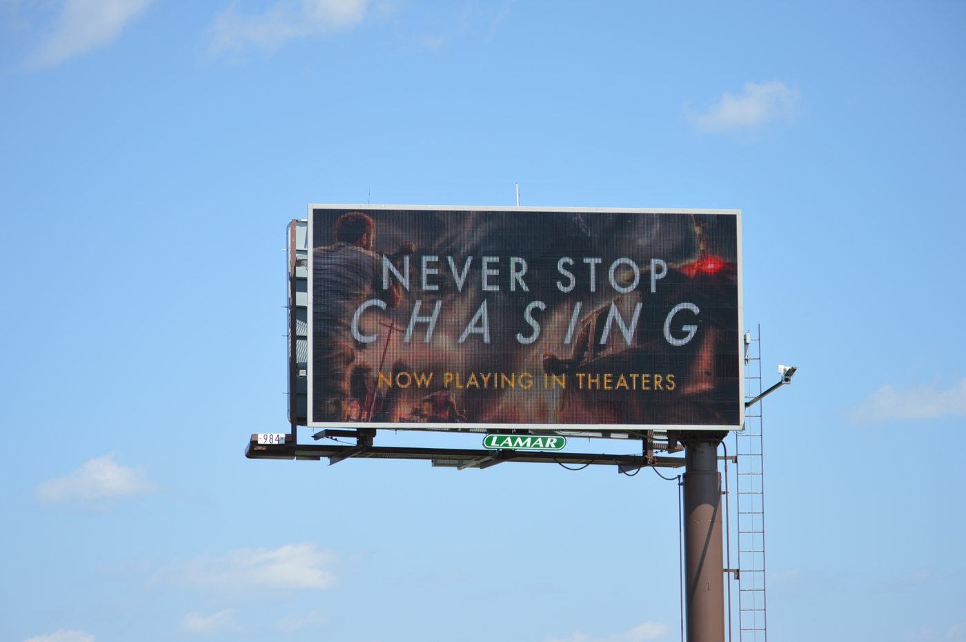 Never Stop Chasing digital bulletin, Panel 984, Now Playing creative