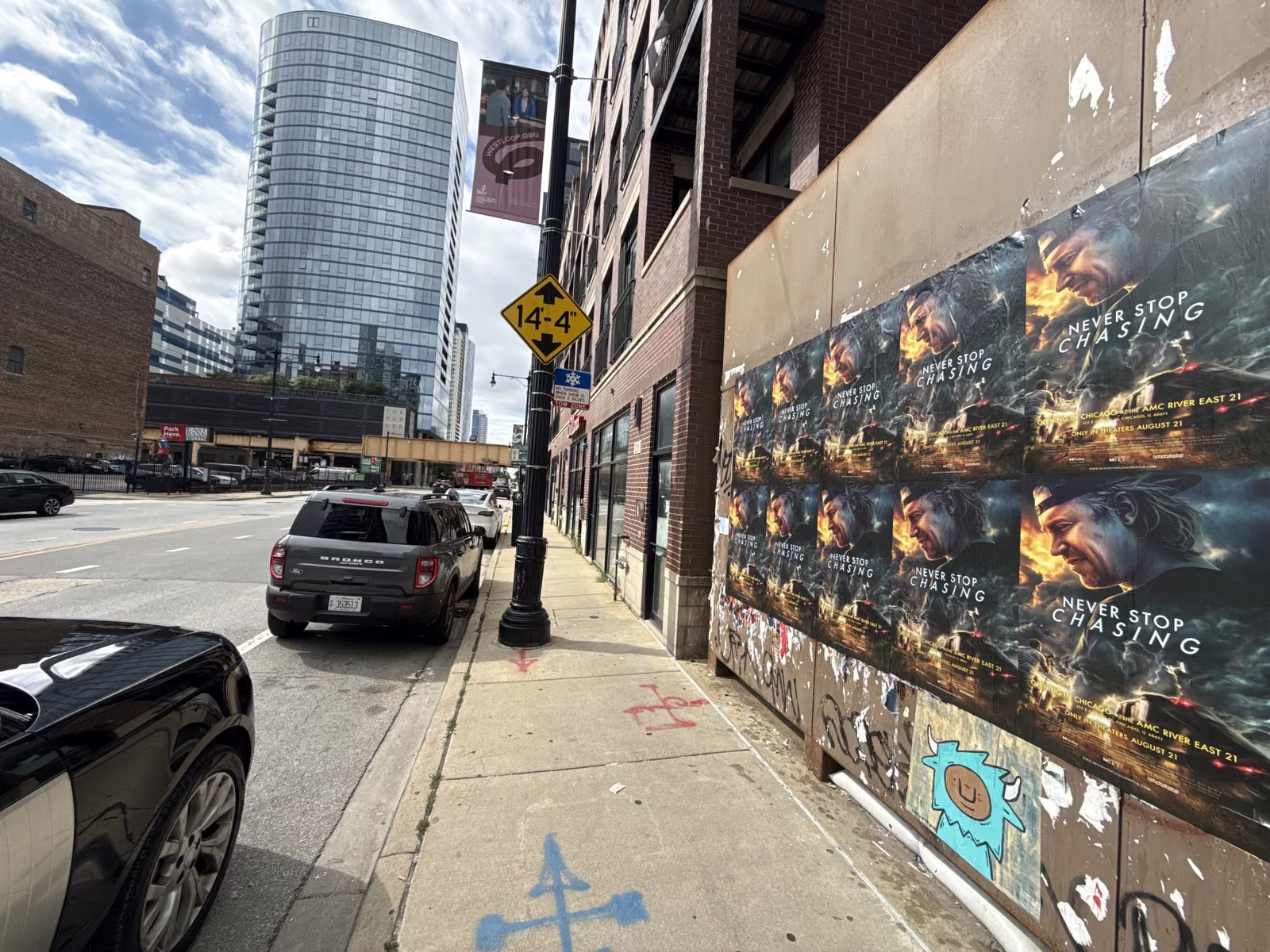 Never Stop Chasing wild posting at 218 N Halsted St, West Loop, Chicago