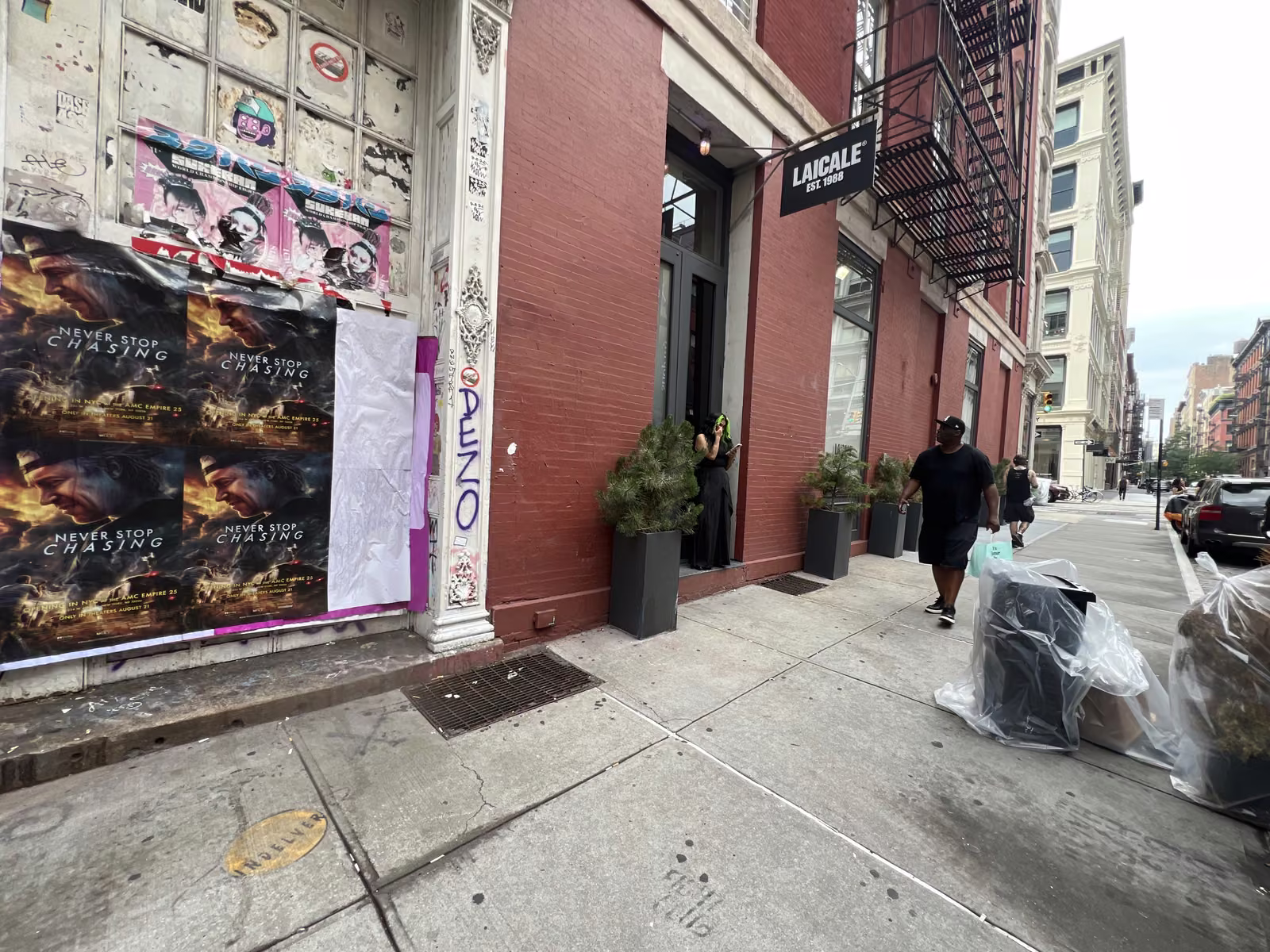 Never Stop Chasing wild posting at 129 Grand St, SoHo, Manhattan