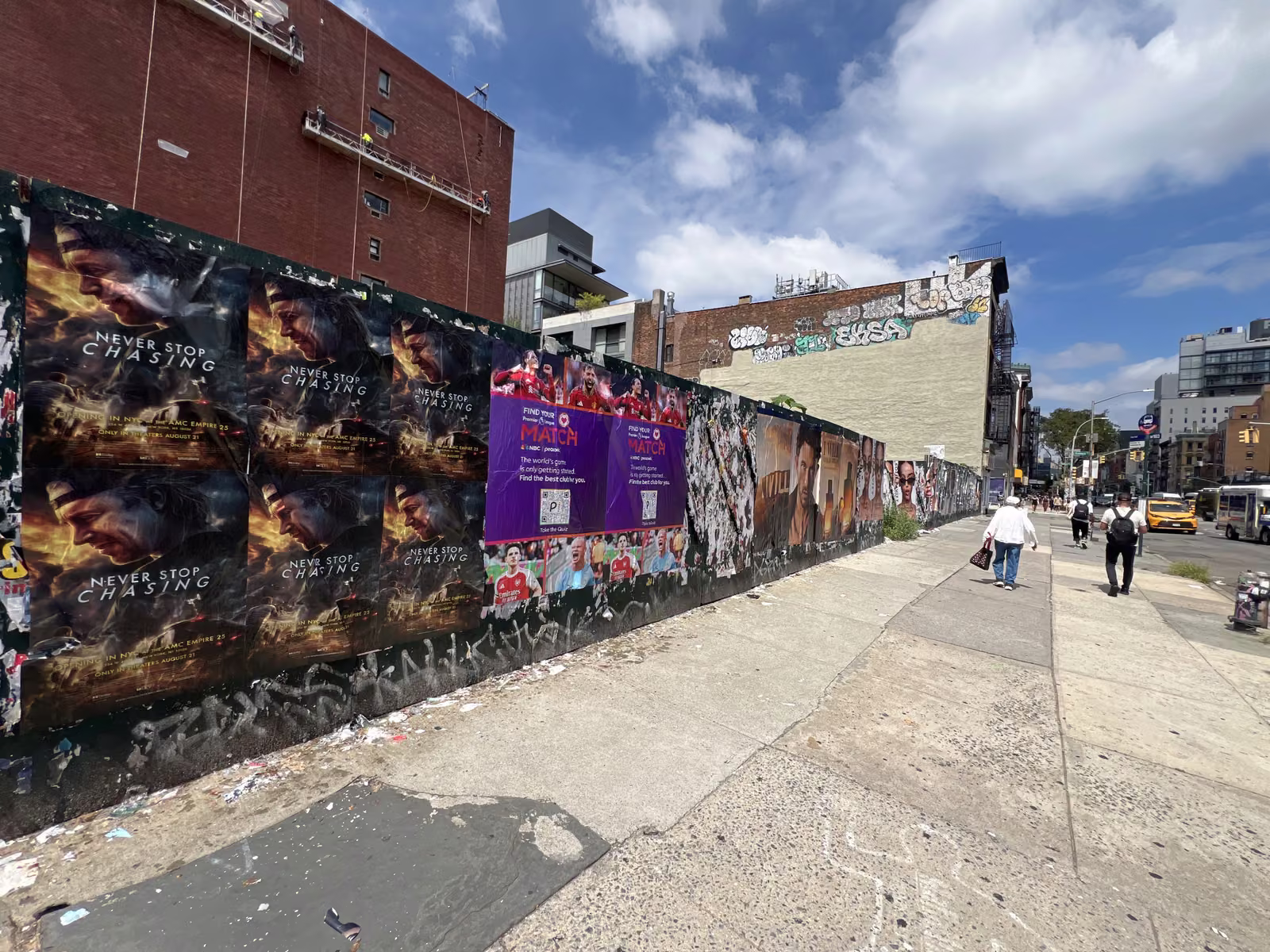 Never Stop Chasing wild posting at 160 Bowery, Lower East Side, Manhattan