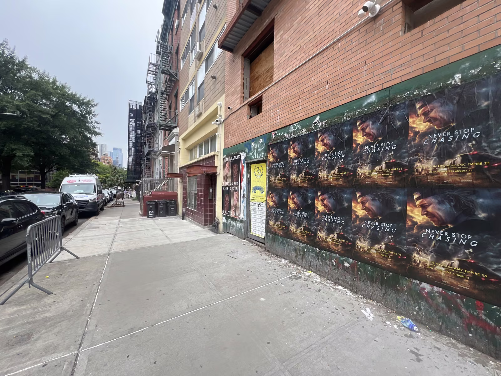 Never Stop Chasing wild posting at 205 Henry St, Lower East Side, Manhattan