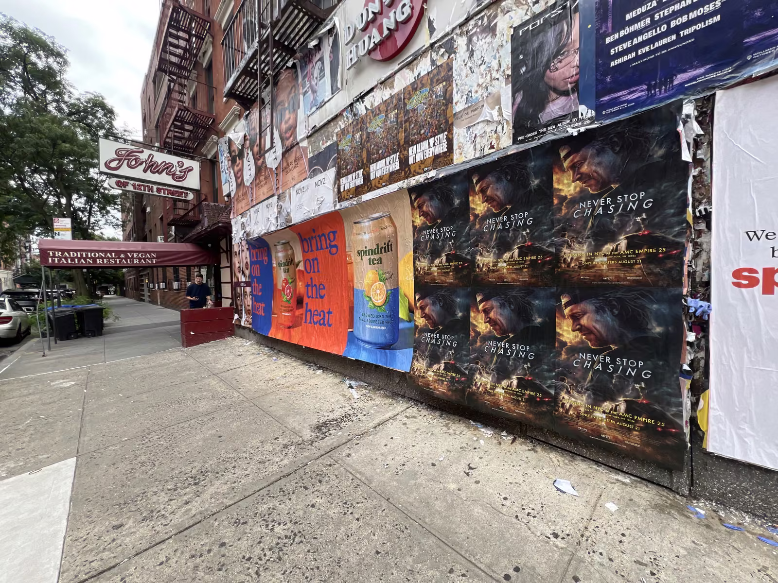 Never Stop Chasing wild posting at 302 E 12th St, East Village, Manhattan