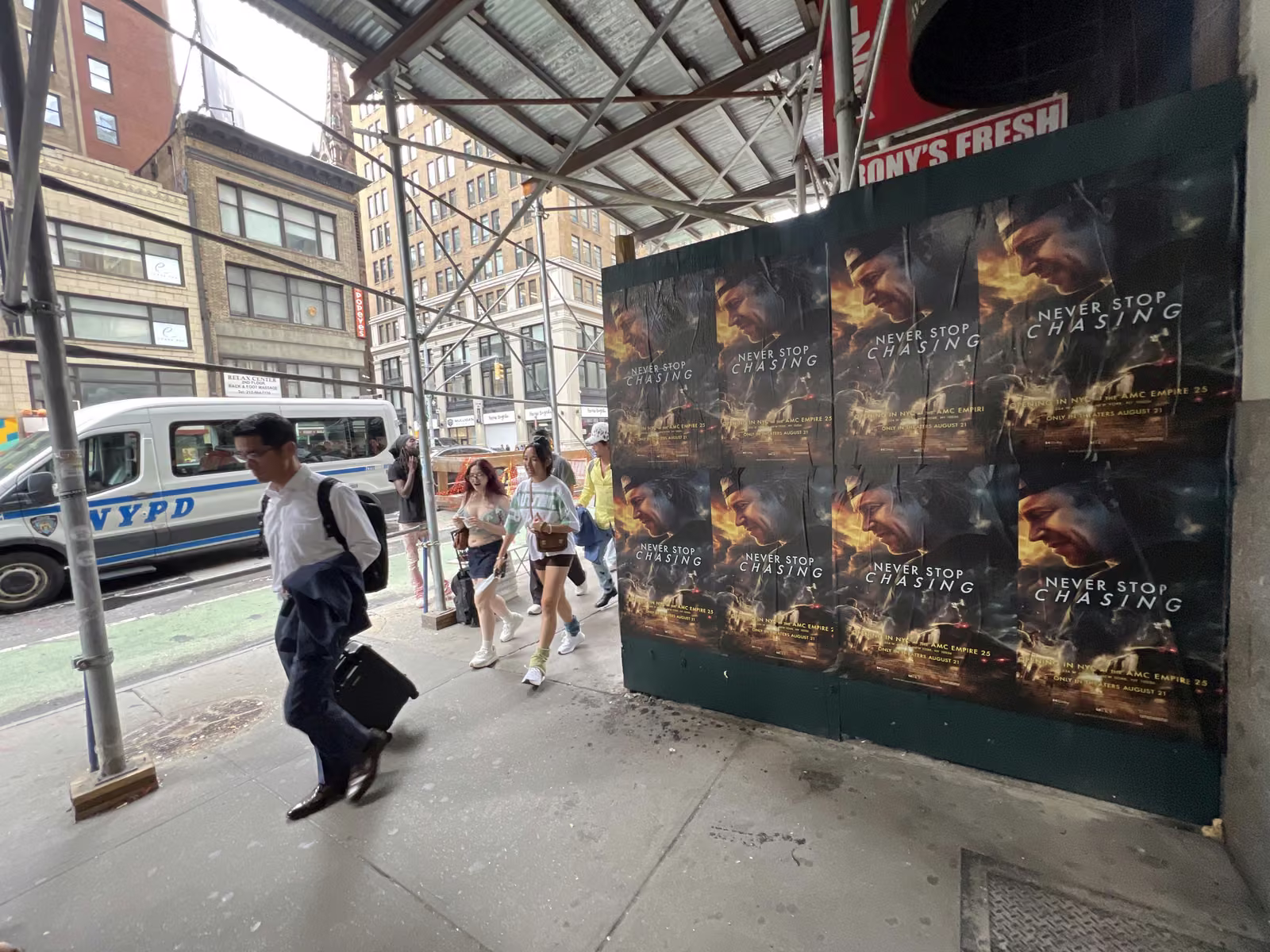 Never Stop Chasing wild posting at 356 7th Ave, Garment District, Manhattan