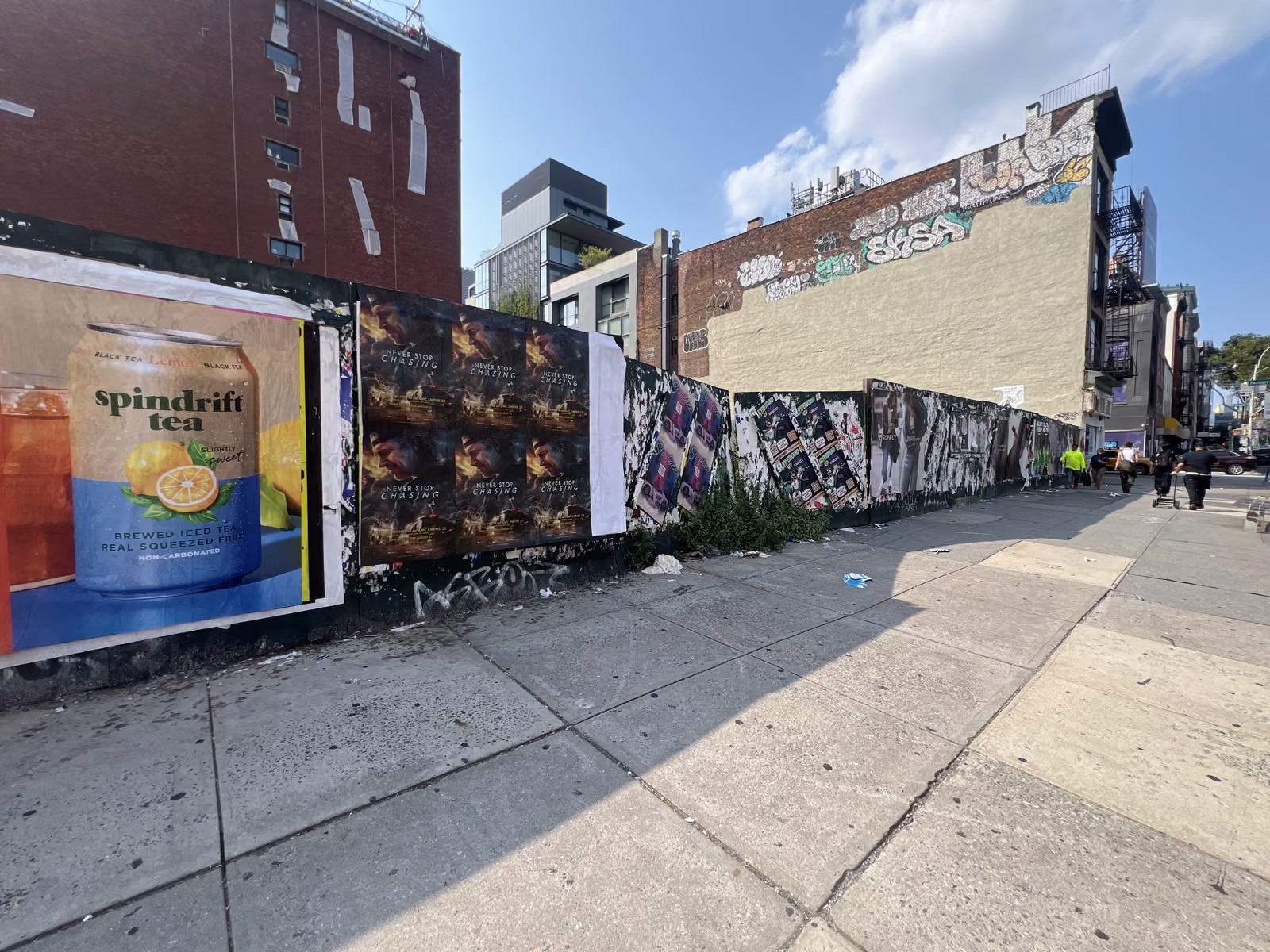 Never Stop Chasing wild posting at 160 Bowery, Lower East Side, Manhattan
