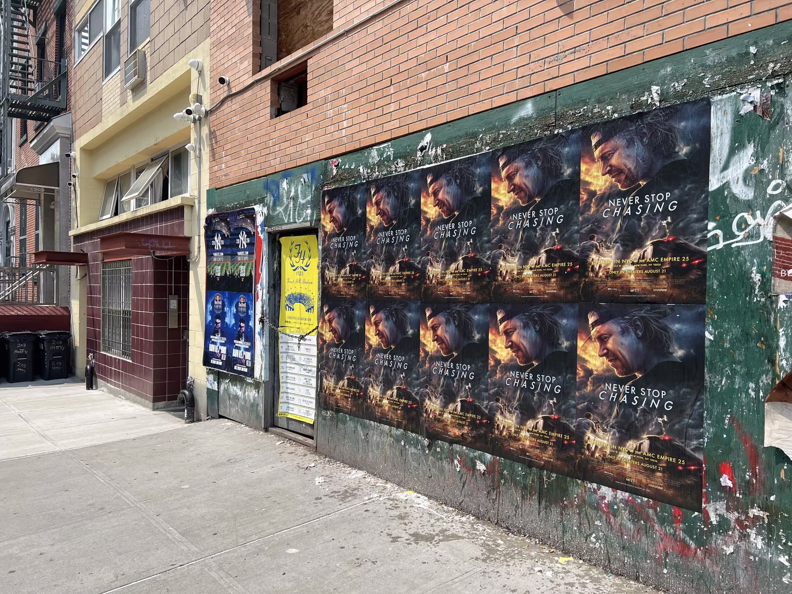 Never Stop Chasing wild posting at 205 Henry St, Lower East Side, Manhattan