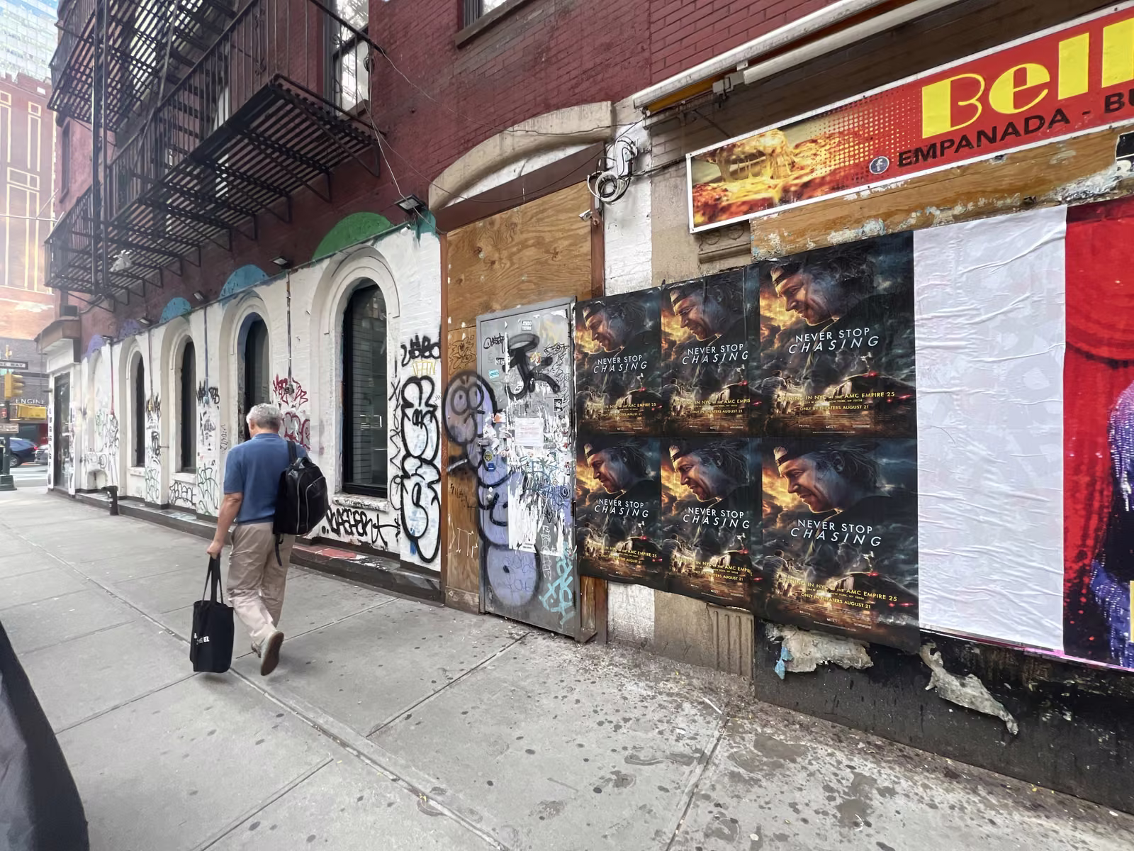 Never Stop Chasing wild posting at 304 W 48th St, Times Square, Manhattan
